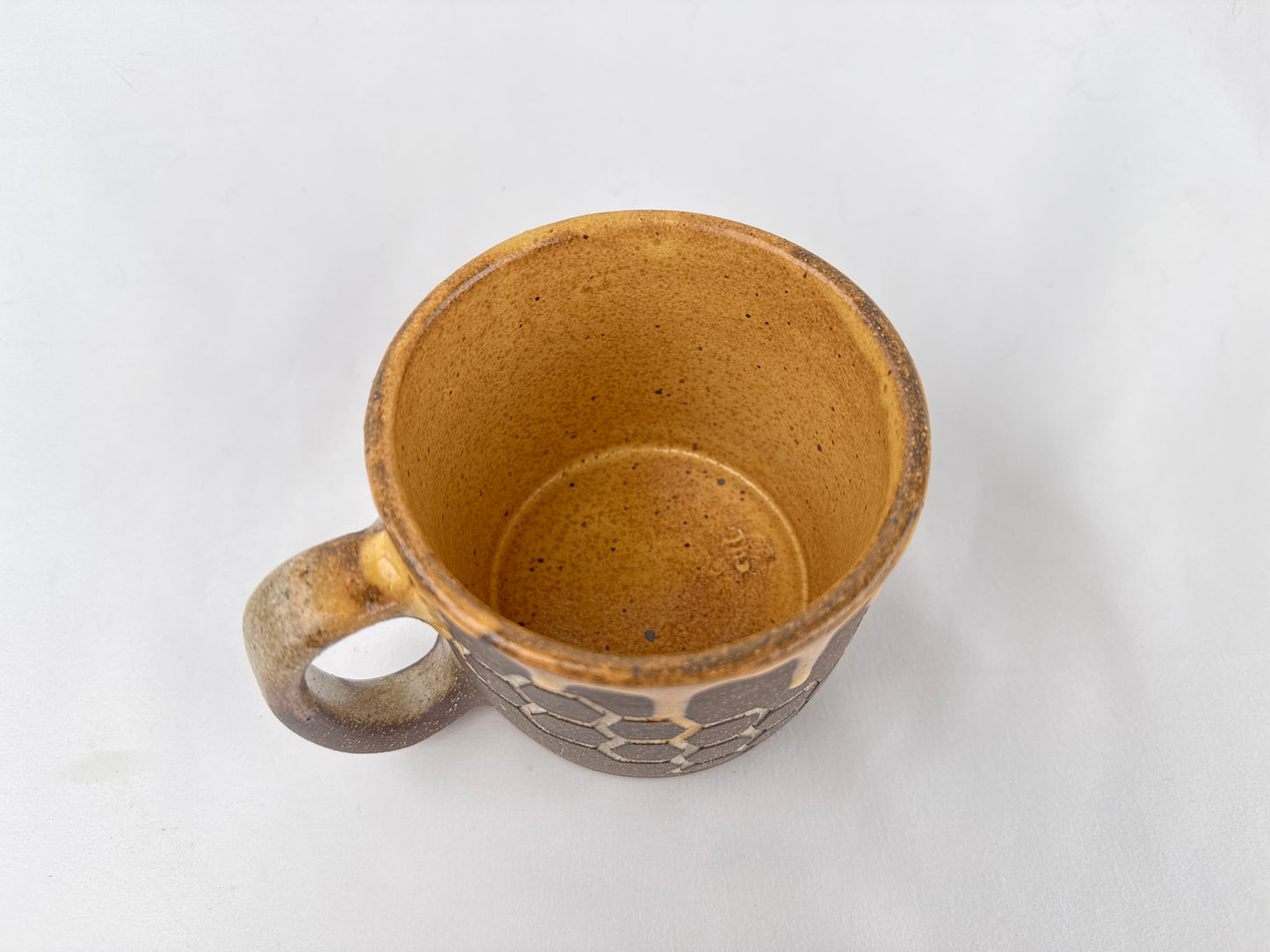 Honey Comb 14oz Coffee Mug on Brown Clay