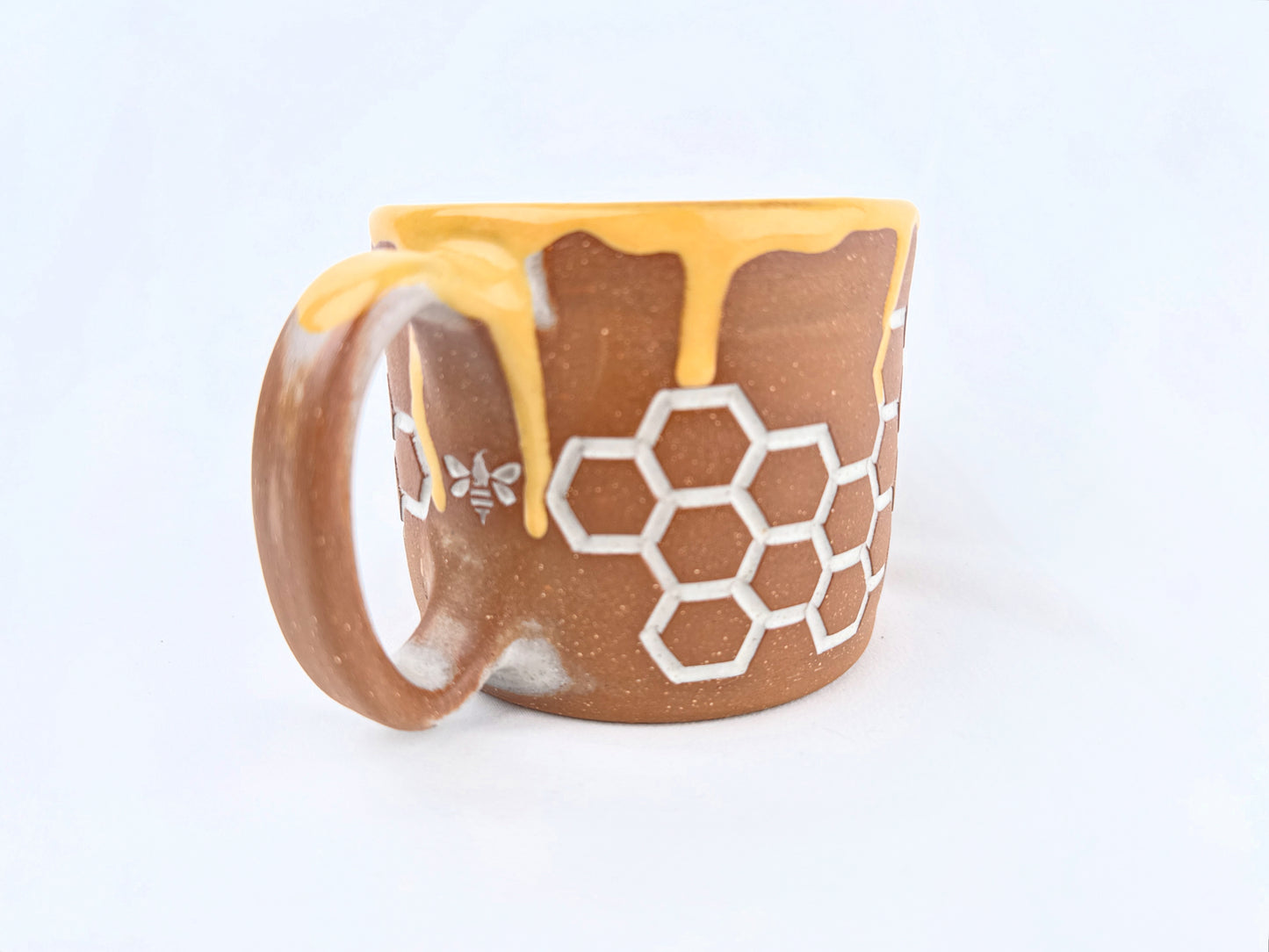 Honey Comb 14oz Coffee Mug on Red Clay