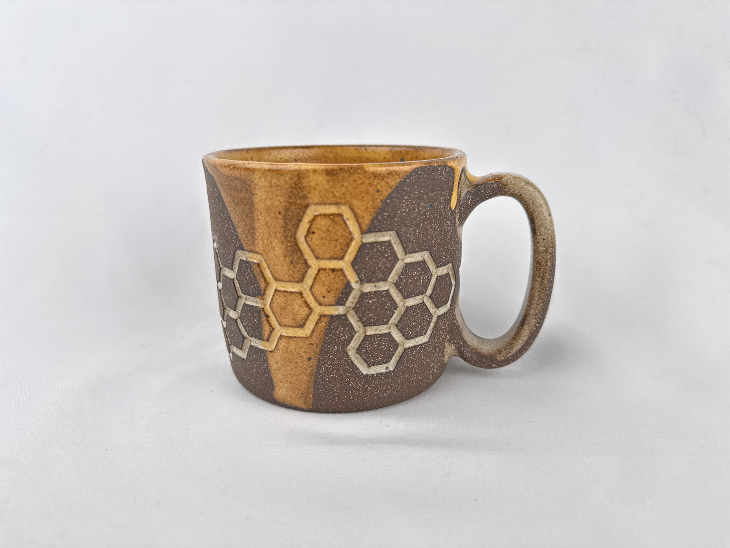 Honey Comb 14oz Coffee Mug on Brown Clay