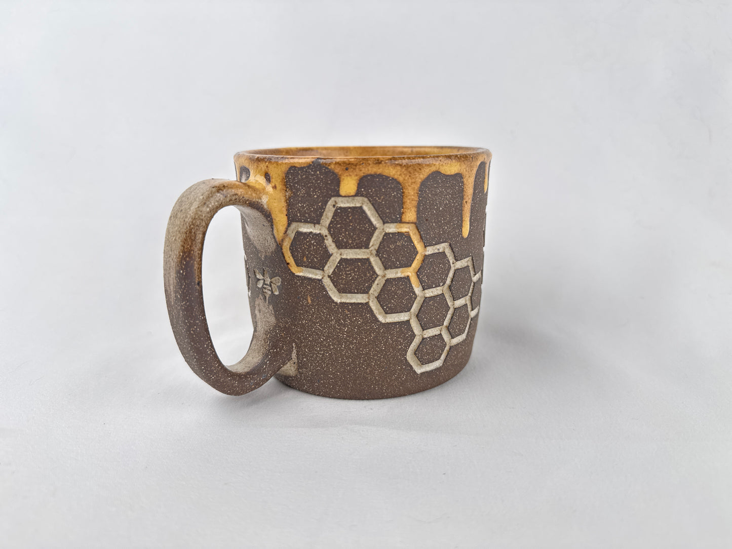 Honey Comb 14oz Coffee Mug on Brown Clay