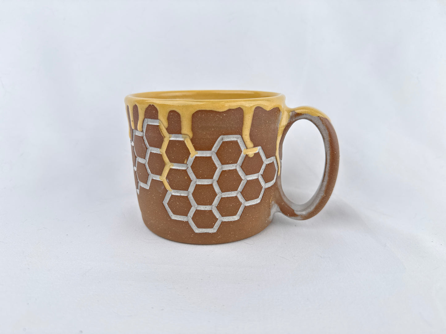 Honey Comb 14oz Coffee Mug on Red Clay