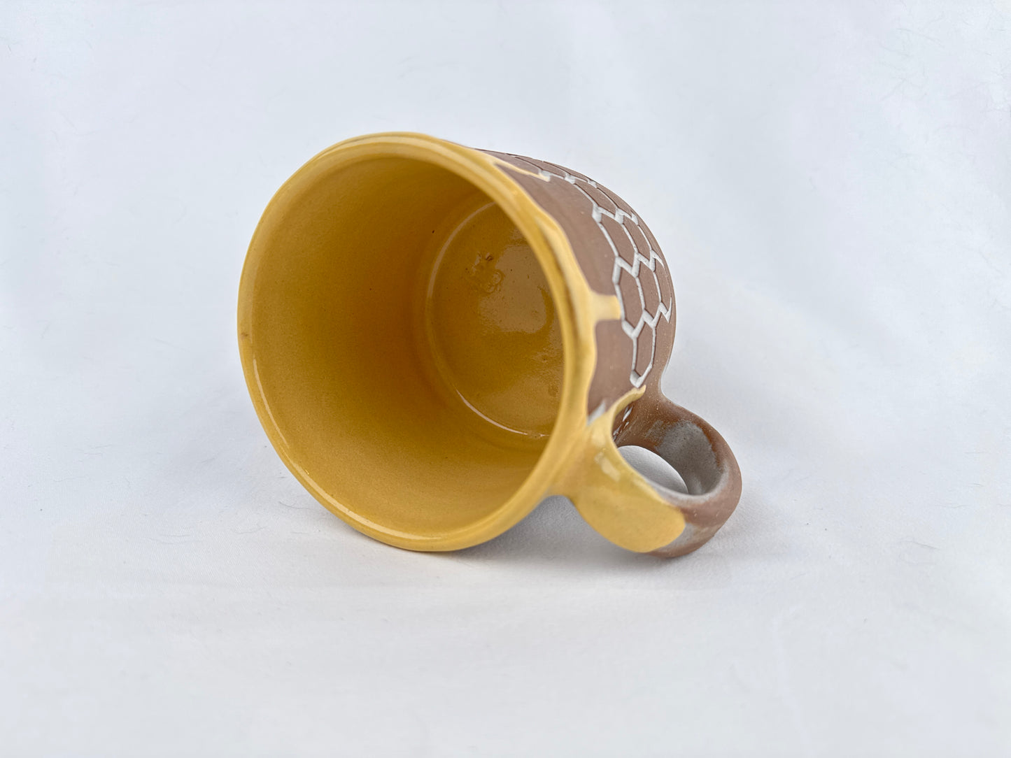 Honey Comb 14oz Coffee Mug on Red Clay